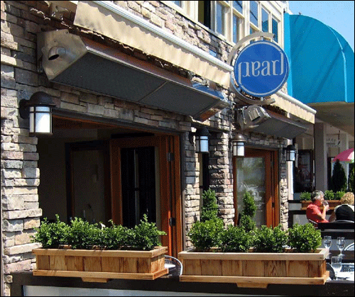 outdoor-infrared-heaters-mounted-above-sidewalk-cafe
